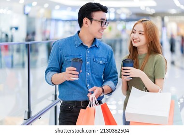 Asian Couple Shopping At The Mall