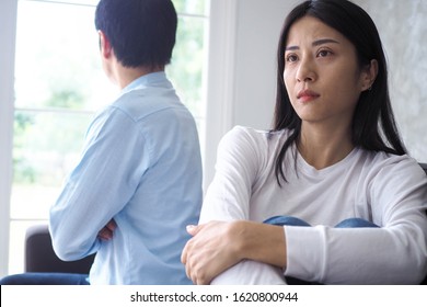 An Asian Couple Is Stressed And Upset After An Argument.