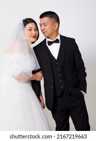 Asian Couple Taking Wedding Photo In Studio