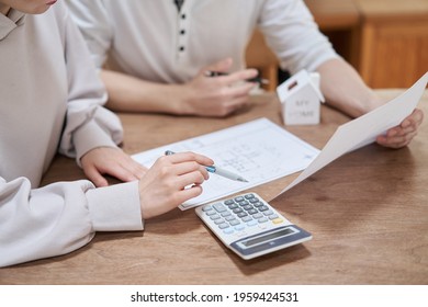 Asian couple thinking about buying a home - Powered by Shutterstock