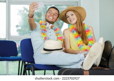 Asian Couple Tourist Taking A Selfie In Airport Before Journey