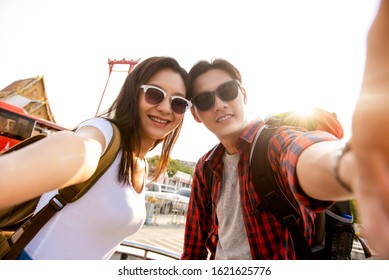 Asian Couple Tourists Taking Selfie While Traveling On Summer Vacations In Bangkok Thailand