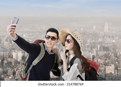 Asian Couple Travel And Selfie In The City.