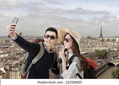 Asian Couple Travel And Selfie In Paris, France.