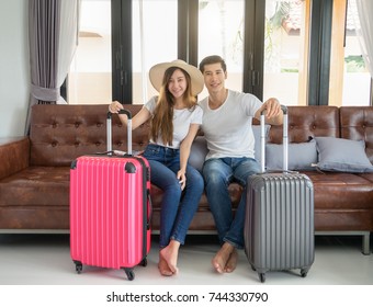 Asian Couple Travelers Prepare Luggage For Travel Trip 