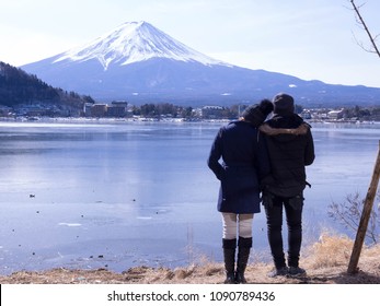 Asian Couple And Valentines Day Travel Concept.Couple Travelers Man And Woman Travel The Beautiful Nature Of Mt. Fuji In Japan. Travel And Attractions Concept.