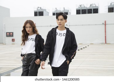 Asian Couple Walking Together In The Street, Fashion, Posing