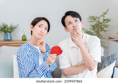 An Asian Couple With Wallet