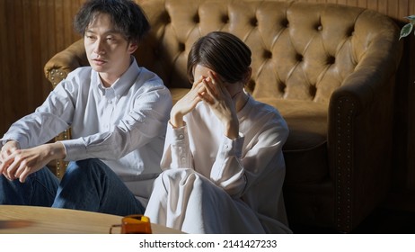 Asian couple who don't get along - Shutterstock ID 2141427233