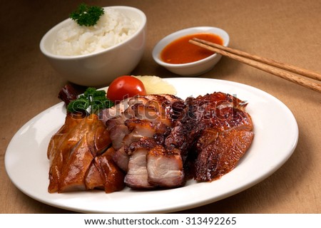 Asian cuisine roasted pork, chicken and duck served with rice