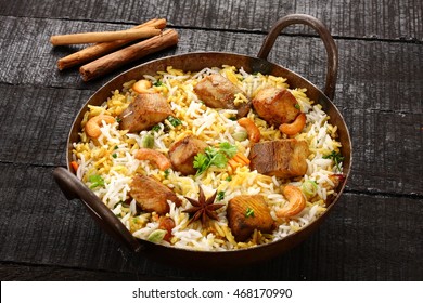 Asian Cuisine Tasty Fish Pilaf Or Biriyani In Cast Iron Pot,Selective Focus Photograph.