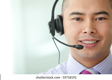 Asian Customer Service Representative Man In An Office