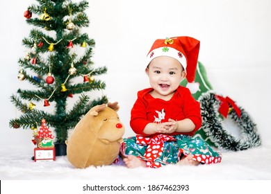 Asian Cute Baby Girl In Christmas Costume On White Background