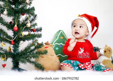 Asian Cute Baby Girl In Christmas Costume On White Background