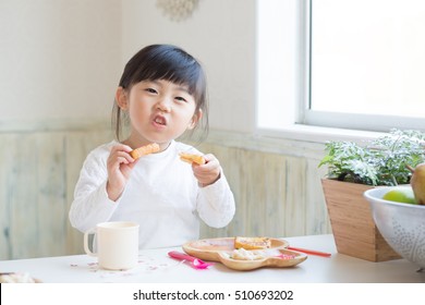 Asian Cute Girl Eating Toast