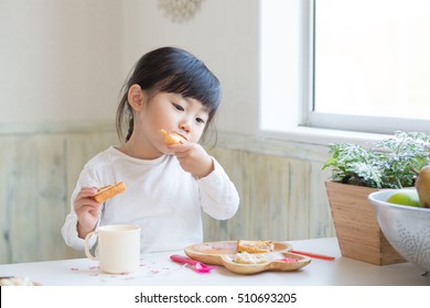 Asian Cute Girl Eating Toast