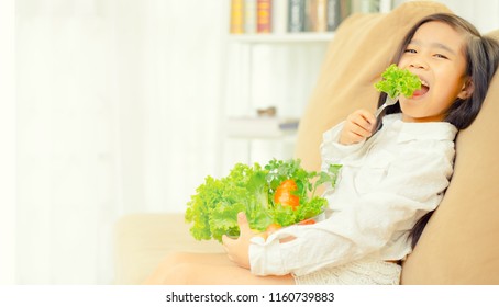 Asian Cute  Girl Eats Fresh Salad  ,healthy Eating Concept