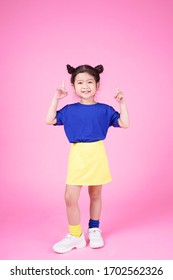 Asian Cute Little Girl Kid With Lovely Expression In Pinky Background