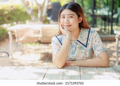 Asian Cute Young Innocent Asian Teen Portrait Smile Sitting Relax Leisure Good Happiness Day.