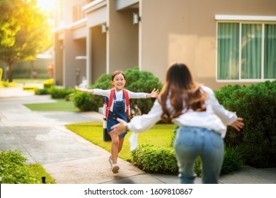 Asian Daughter Run To Her Mother After Come Back From Her Preschool, This Image Can Use For Single Mom, School, Family, Education, Home, House And Outdoor Concept