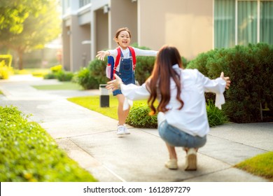 Asian Daughter Run To Her Mother After Come Back From Her Preschool, This Image Can Use For Single Mom, School, Family, Education, Home, House And Outdoor Concept