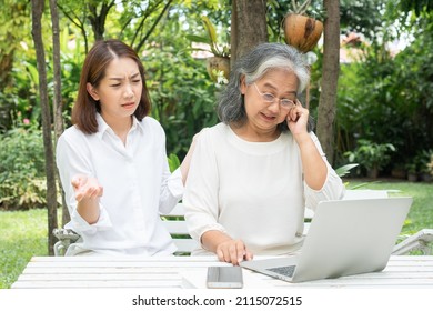 Asian Daughter Teaching Old Elderly Woman Use Online Social Media In Computer Laptop After Retirement. Concept Of Learning Technology And Adaptation Of The Elderly