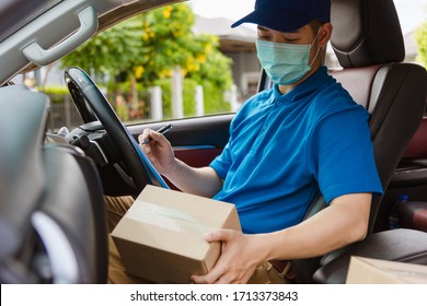 Asian Delivery Courier Young Man Driver Inside The Van Car With Parcel Post Boxes Checking Amount He Protective Face Mask, Under Curfew Quarantine Pandemic Coronavirus COVID-19