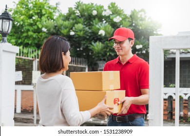 Asian Delivery Man Deliver Box Parcel Package To Customer At Home, Shipping Delivery Concept