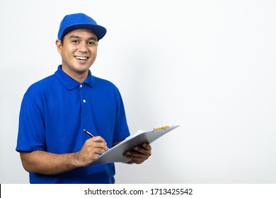 Asian Delivery Man Signing Clipboard Receipt Of Delivery Package On Isolated White Background.