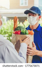 Asian Delivery Man Wearing Face Mask Hand Giving Bag Of Food, Fruit, Vegetable Delivery To Female Customer Grocery Delivery Service During Covid19.