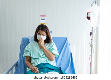 Asian Depressed CORONA Or COVID-19 Patient Infection Wear Mask And Get Blood Transfusion In Quarantine Room At The Hospital