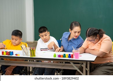 Asian disability child boy and Autism kid learning drawing in classroom