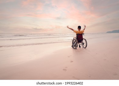 Asian disabled child on wheelchair is fun with activity on the beach in family holiday travel and learning about nature around the sea beach, Lifestyle in the education age,Happy disabled kid concept.