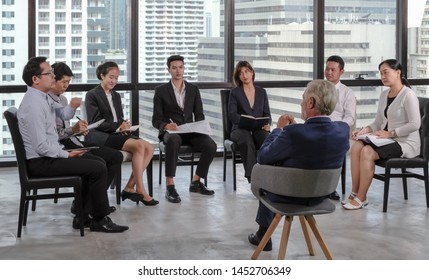 Asian diversity business people are serious meeting with their boss. Senior executive manager discussing with new asian work team, selective focus. - Shutterstock ID 1452706349