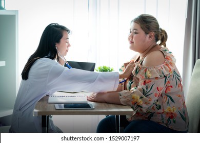 Asian doctor checking fat girl body in hospital, this image can use for sick, healthy and infant concpet
