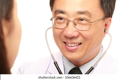 Asian Doctor With His Patient On White Background