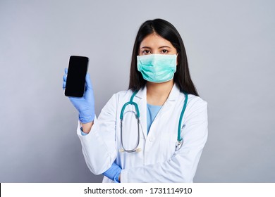 Asian Doctor Holding A Mobile Phone