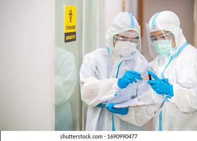 Asian doctor show corona or covid-19 blooding tube wearing ppe suit and face mask in hospital. Corona virus, Covid-19, virus outbreak, medical mask, hospital, quarantine or virus outbreak concept