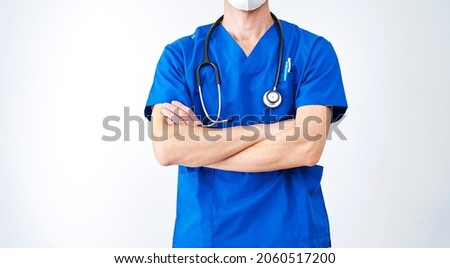 Asian doctor standing in white, no face