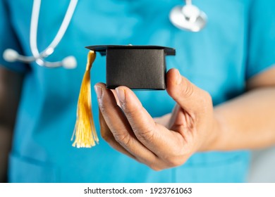 Asian doctor study learn with graduation gap hat in hospital ward : clever bright genius education medicine concept.