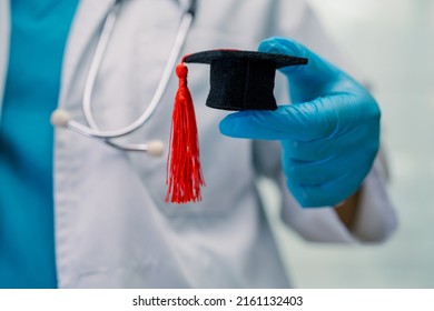 Asian doctor study learn with graduation gap hat in hospital ward, clever bright genius education medicine concept. - Shutterstock ID 2161132403