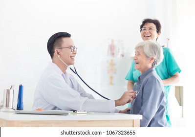 Asian Doctor Talk With Old Female Patient About Disease Symptom, Elderly Health Check Up , Happy Hospital