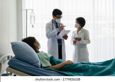 Asian Doctor Teach Medical Student By Bedside Teaching Technique To Treat Sick Patient In The Ward In Hospital. Healthcare And Medical School Concept