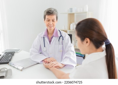 asian doctor use hand screening pulse rate and vital sign of patient, doctor treatment patient in hospital, adult health check up , they talking about disease symptom - Shutterstock ID 2206074725