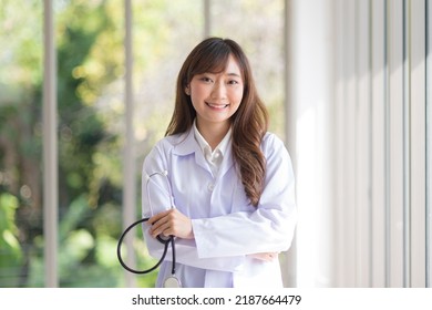 Asian Doctor Woman Portrait In Professional Uniform Standing With Smile And Confidence.