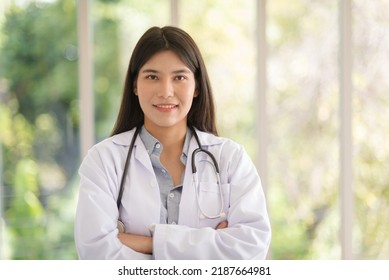 Asian Doctor Woman Portrait In Professional Uniform Standing With Smile And Confidence.