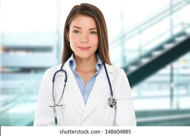 Asian Doctor Woman Portrait. Serious Female Doctor Or Nurse Smiling Looking At Camera Doctor In Lab Coat Wearing Stethoscope In Hospital.