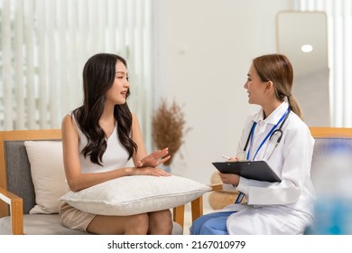 Asian Doctor Woman Visited Patient Woman To Diagnosis And Check Up Health At Home Or Private Hospital. Female Patient Explain Health Problem And Symptoms To Doctor .Health Care Premium Service At Home