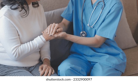 Asian doctor woman visited patient woman to diagnosis and check up health at home or private hospital. Female patient explain health problem and symptoms to doctor .Health care premium service at home - Shutterstock ID 2332900097