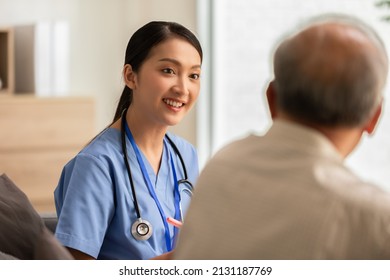 Asian Doctor Woman Visited Senior Or Elderly Patient To Diagnosis And Check Up Health At Home.Happy Elderly Enjoy Cheerful With Doctor Or Nurse On Couch.Health Care Premium Service At Home